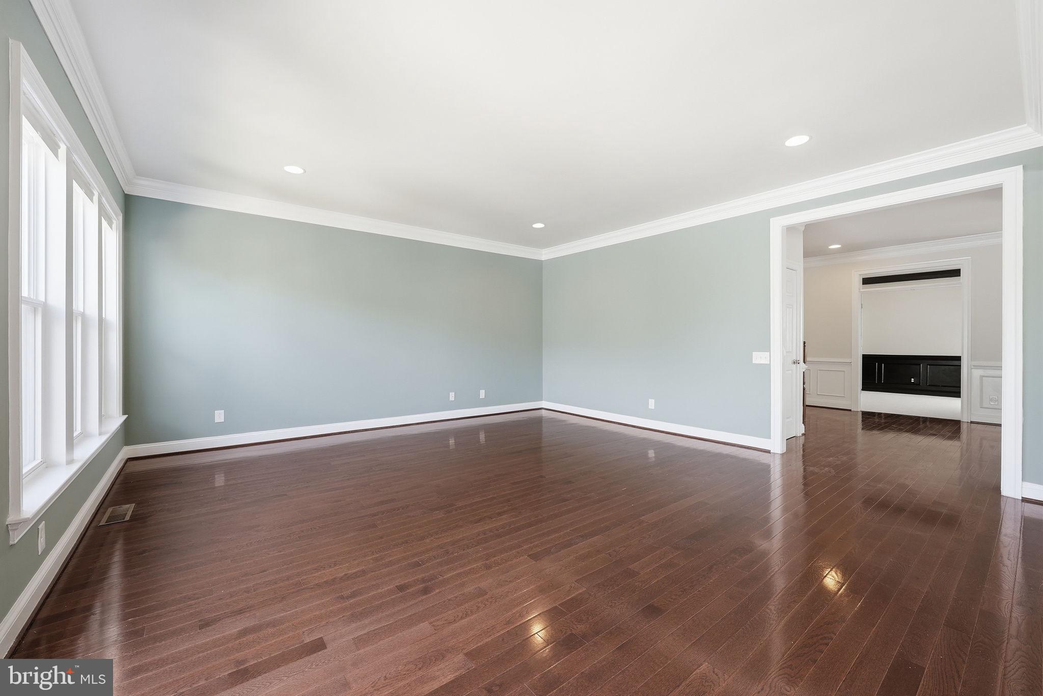 42330 Christophers View Terrace Ashburn, VA 20148 - Photo 6 of 46 wooden floor in an empty room with a window