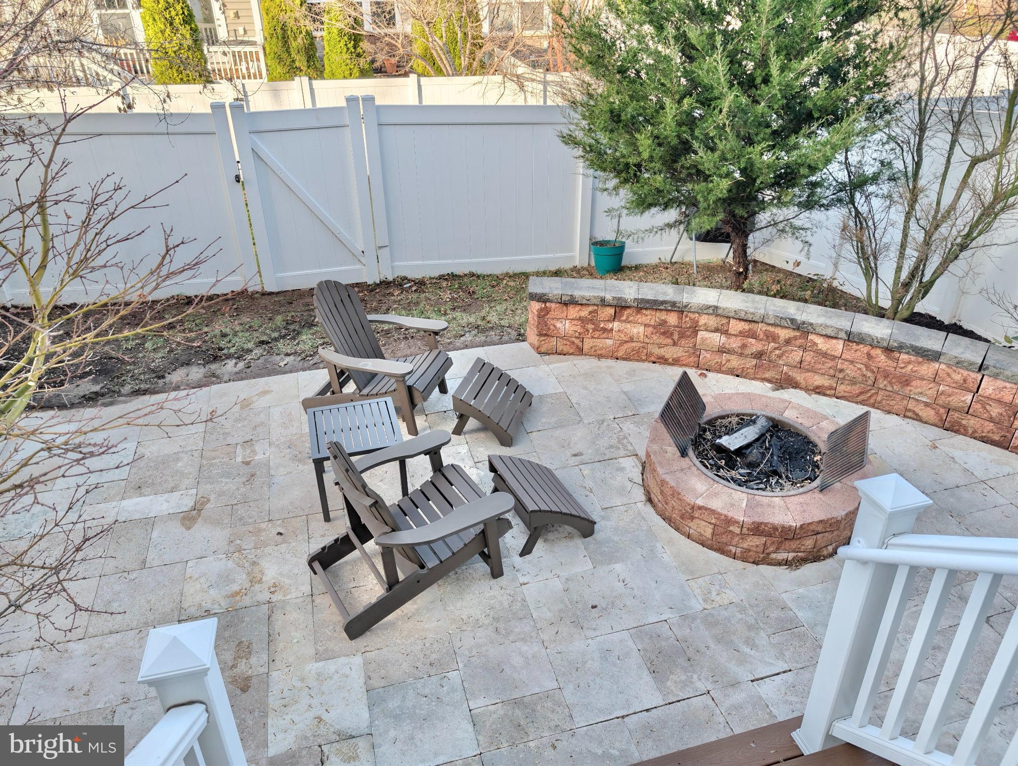 42330 Christophers View Terrace Ashburn, VA 20148 - Photo 7 of 7 a view of a backyard with chair and tables
