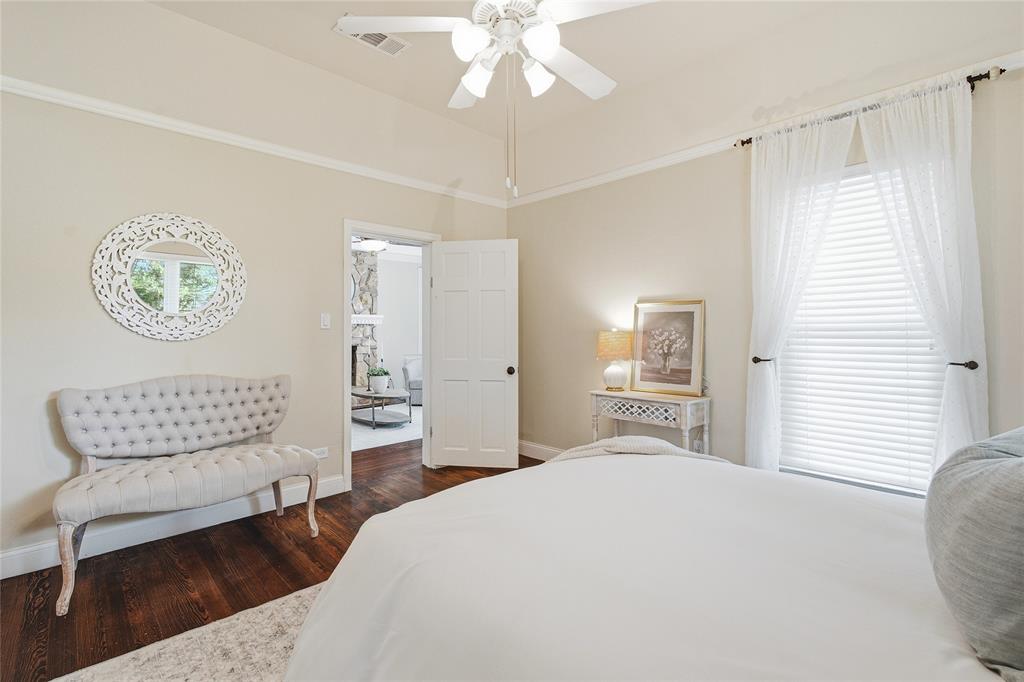 9121 6th Street Frisco, TX 75033 - Photo 14 of 27 a bedroom with a bed mirror and window
