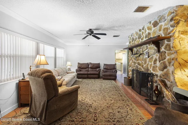 a living room with furniture fireplace and a flat screen tv