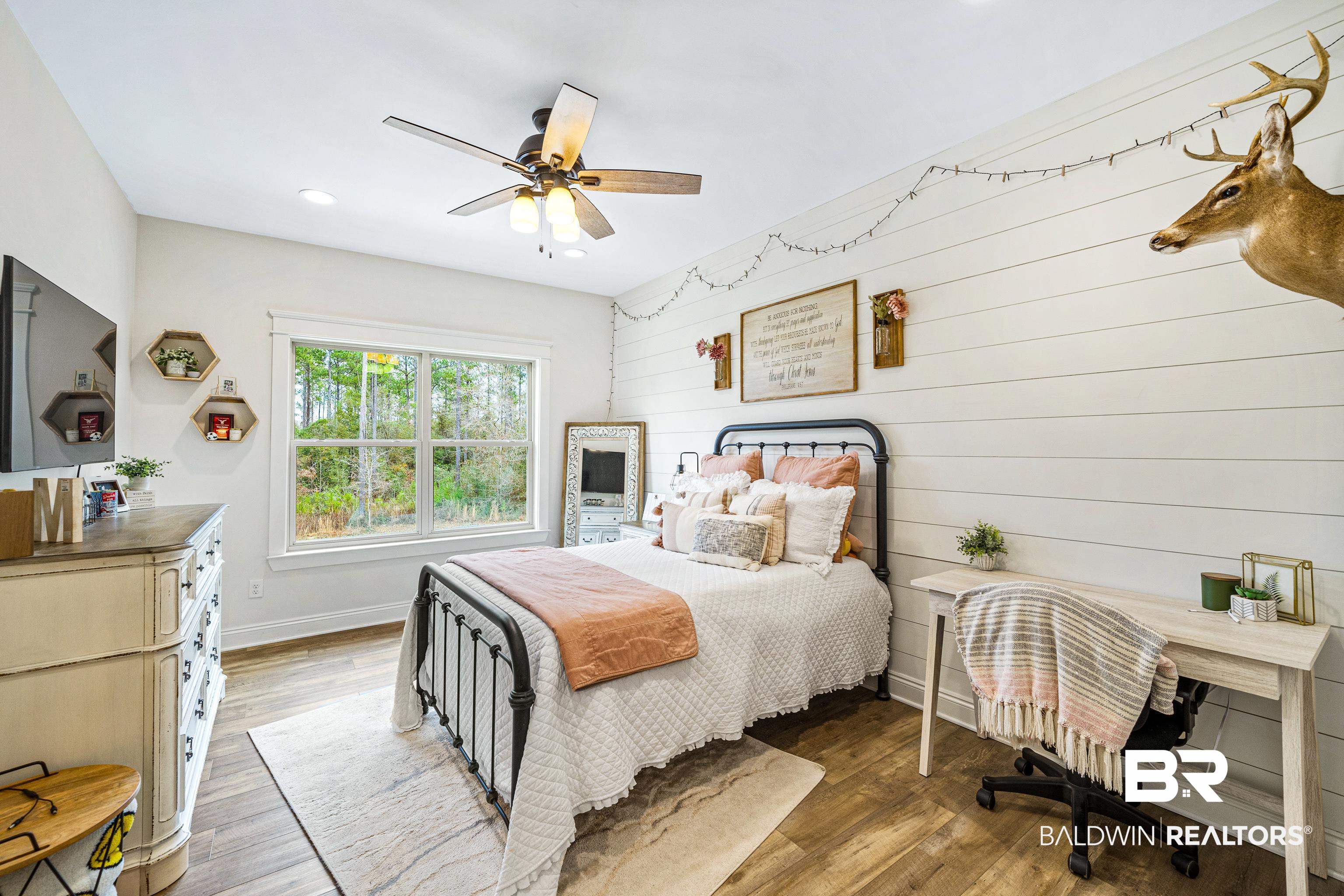 36784 Legacy Way Bay Minette, AL 36507 - Photo 37 of 57 Upper level bedroom featuring wood-style floors, ceiling fan, shiplap walls and walk-in closet.