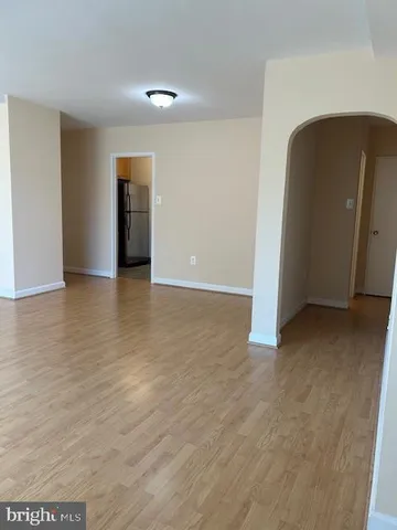 a view of a livingroom with wooden floor