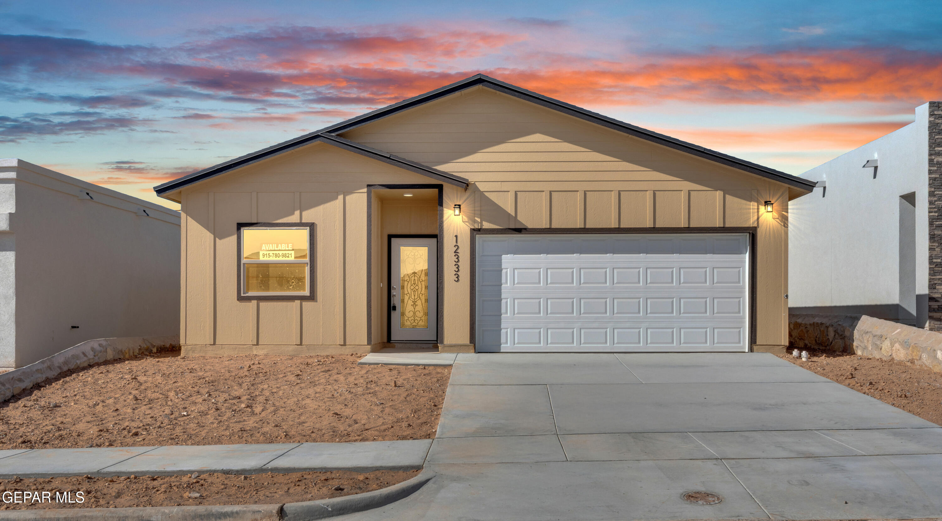 a front view of a house with a garage
