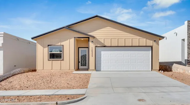 a front view of a house with a garage