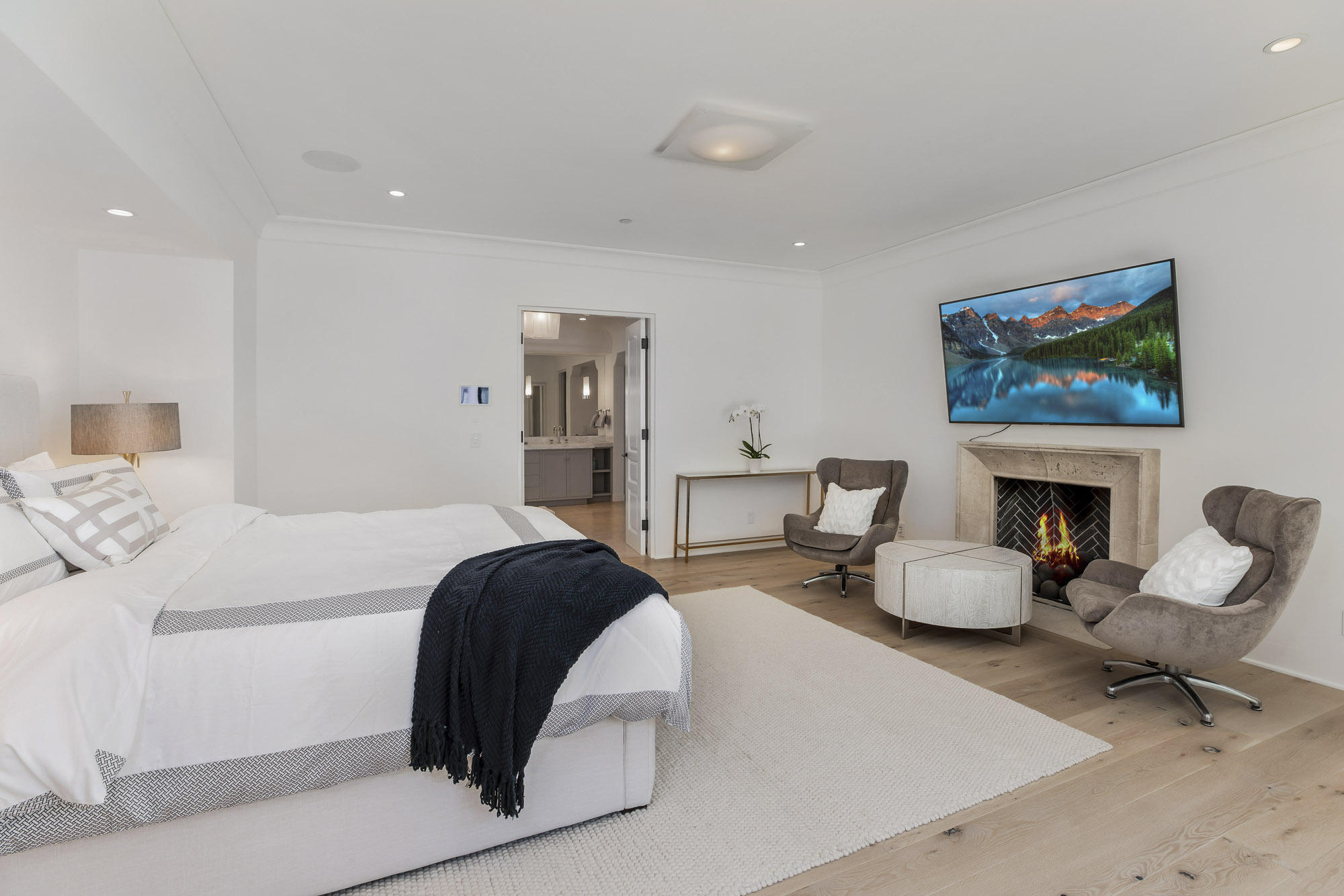 1084 Golf Road Montecito, CA 93108 - Photo 14 of 47 a bedroom with a bed a chair and a fireplace