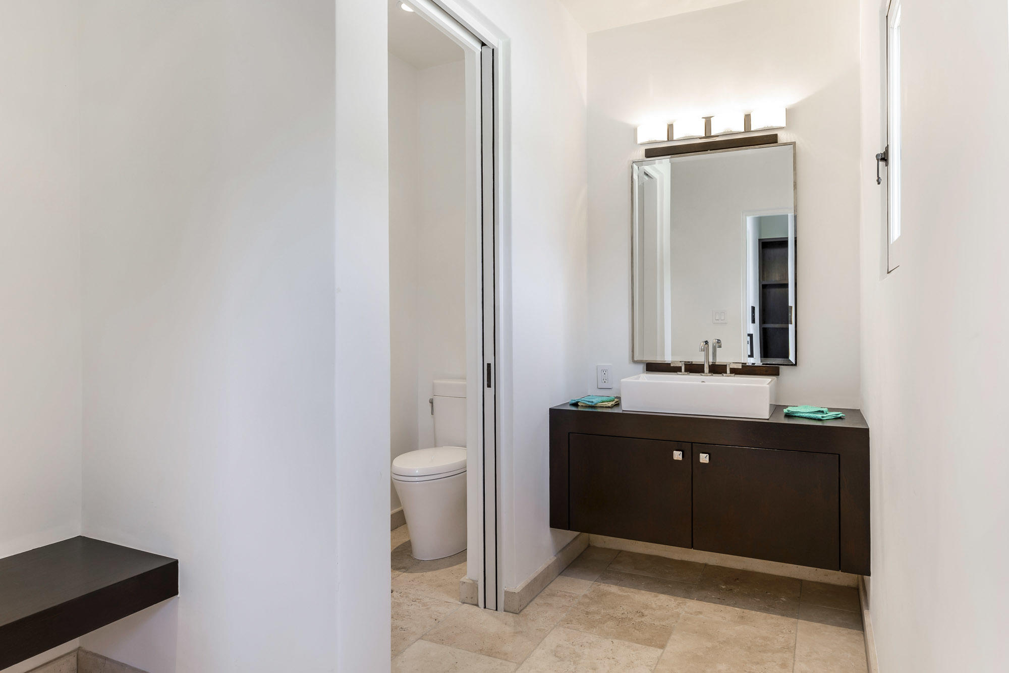 1084 Golf Road Montecito, CA 93108 - Photo 34 of 47 a bathroom with a toilet a sink and mirror