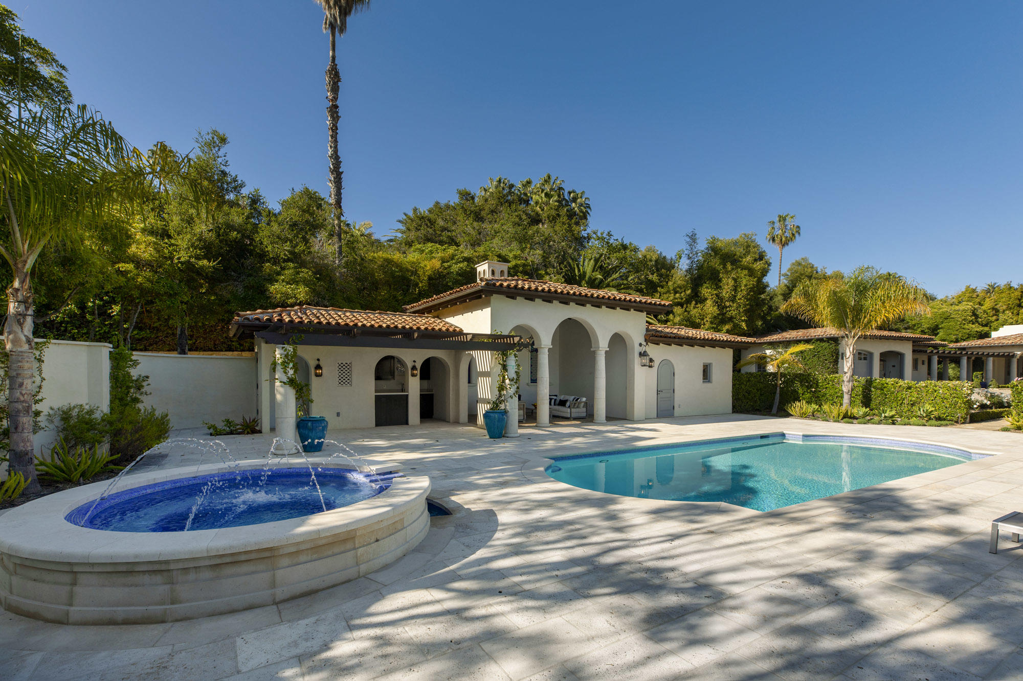1084 Golf Road Montecito, CA 93108 - Photo 37 of 47 a front view of a house with swimming pool and porch