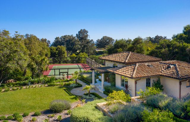 a aerial view of a house with a big yard