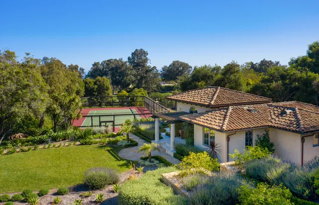 a aerial view of a house with a big yard