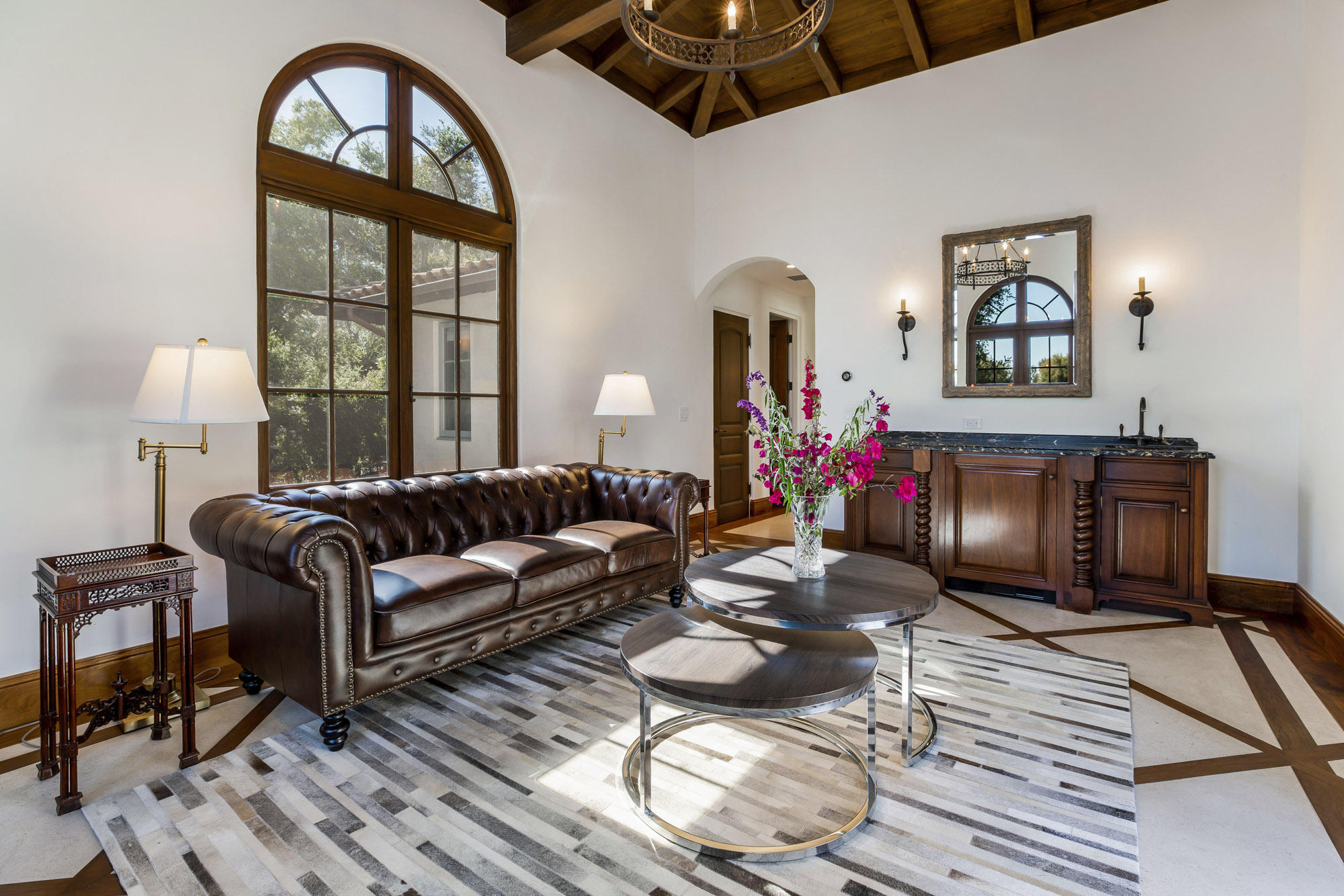 1084 Golf Road Montecito, CA 93108 - Photo 40 of 47 a living room with furniture a fireplace and wooden floor