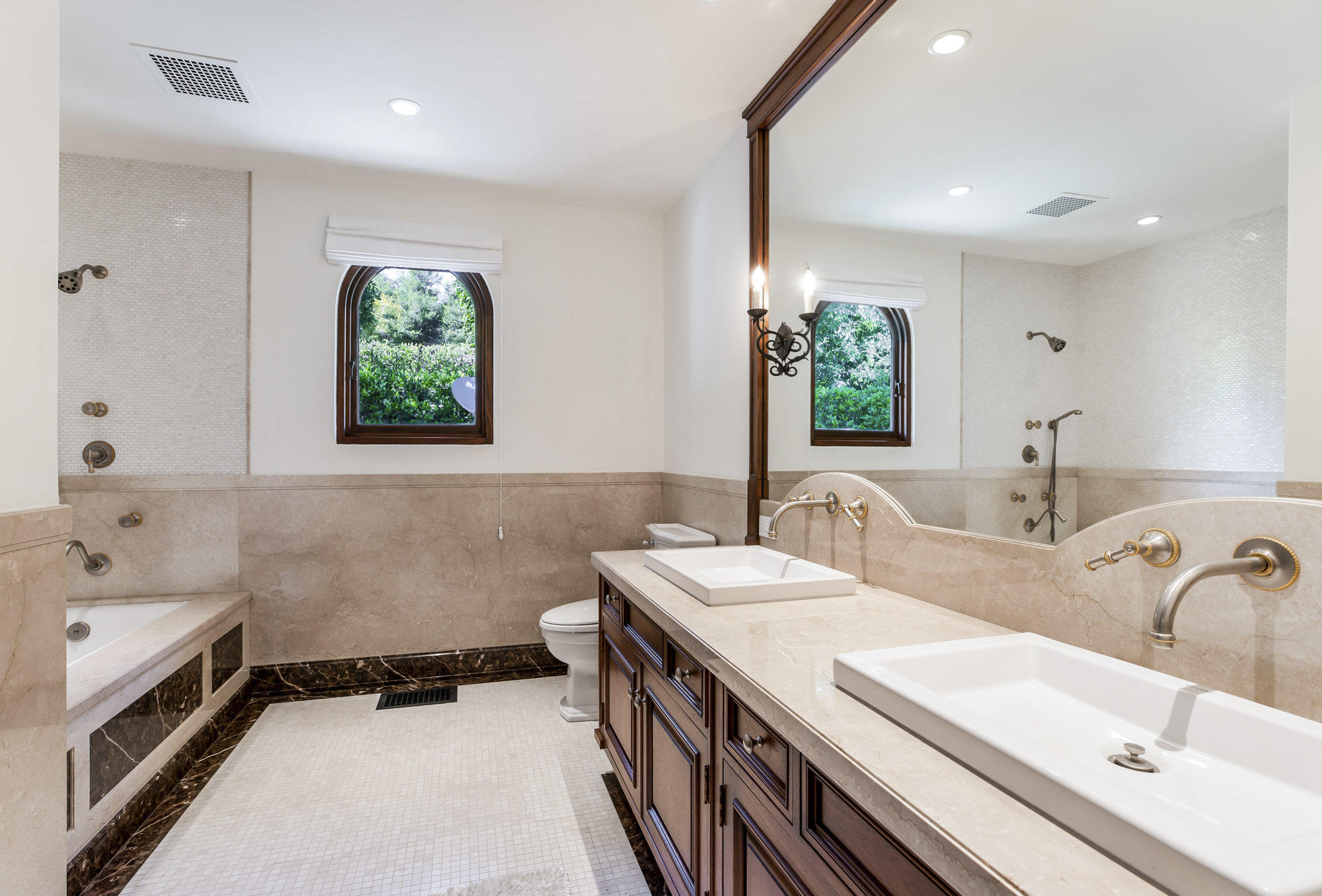 1084 Golf Road Montecito, CA 93108 - Photo 42 of 47 a bathroom with a double vanity sink window and a bathtub