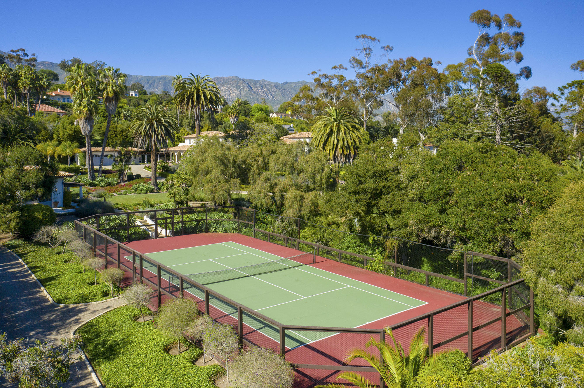 1084 Golf Road Montecito, CA 93108 - Photo 46 of 47 a view of a tennis ground with large trees