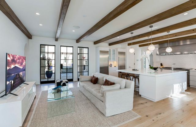 a living room with furniture and flat screen tv