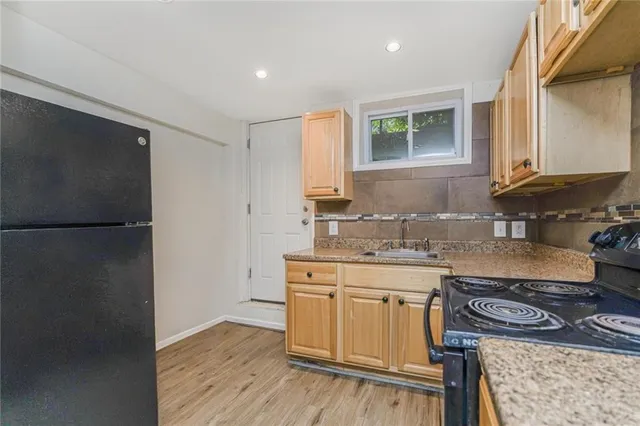a kitchen with a stove and a sink