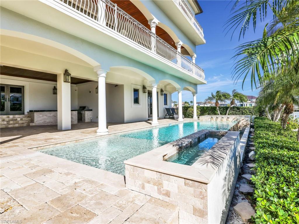 264 Bayview Avenue Naples, FL 34108 - Photo 12 of 50 a view of a house with a swimming pool