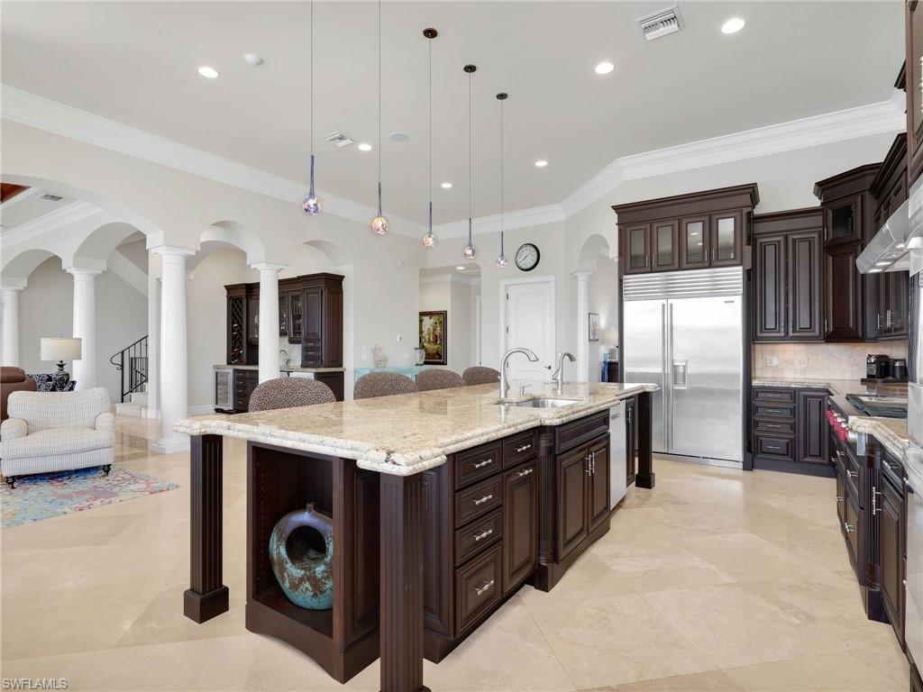 264 Bayview Avenue Naples, FL 34108 - Photo 18 of 50 a large kitchen with stainless steel appliances granite countertop a lot of counter space and a sink