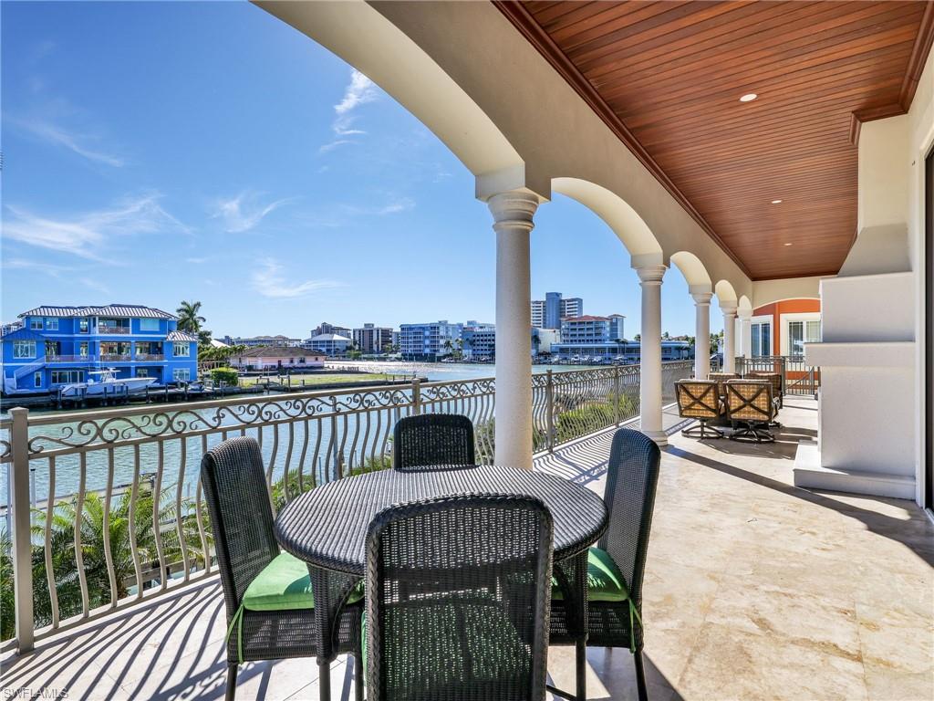 264 Bayview Avenue Naples, FL 34108 - Photo 22 of 50 a view of a chairs and table in the balcony