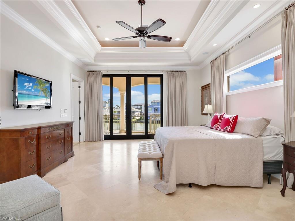 264 Bayview Avenue Naples, FL 34108 - Photo 27 of 50 a living room with furniture a ceiling fan and a large window