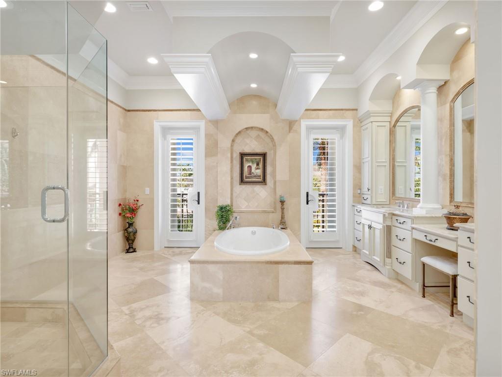 264 Bayview Avenue Naples, FL 34108 - Photo 28 of 50 a spacious bathroom with a tub shower and sink