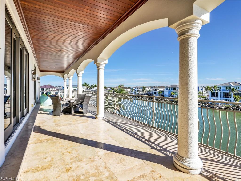 264 Bayview Avenue Naples, FL 34108 - Photo 32 of 50 a view of a balcony with chairs