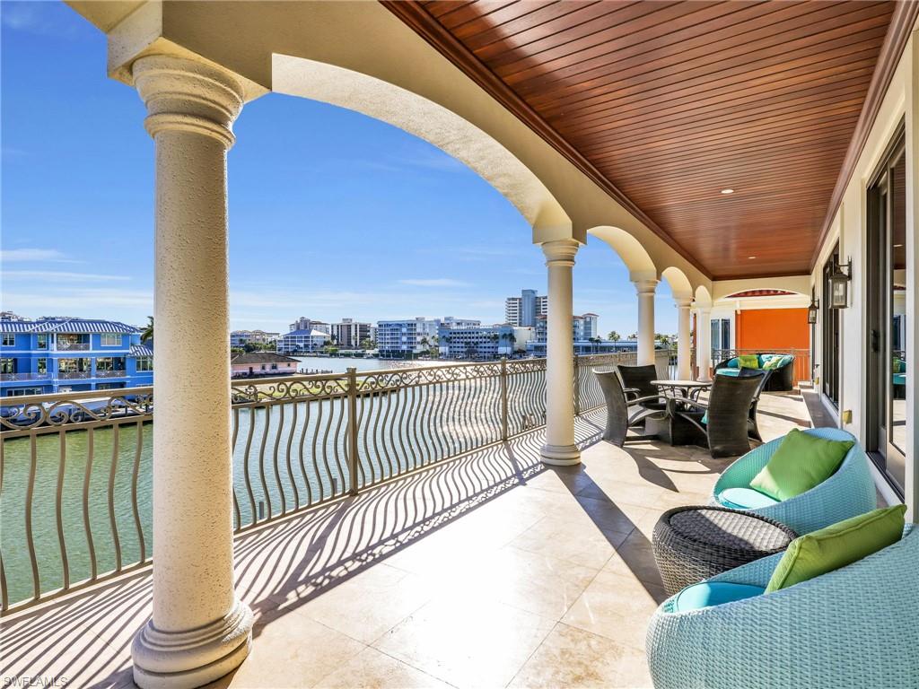 264 Bayview Avenue Naples, FL 34108 - Photo 33 of 50 a view of a balcony with couch and chairs
