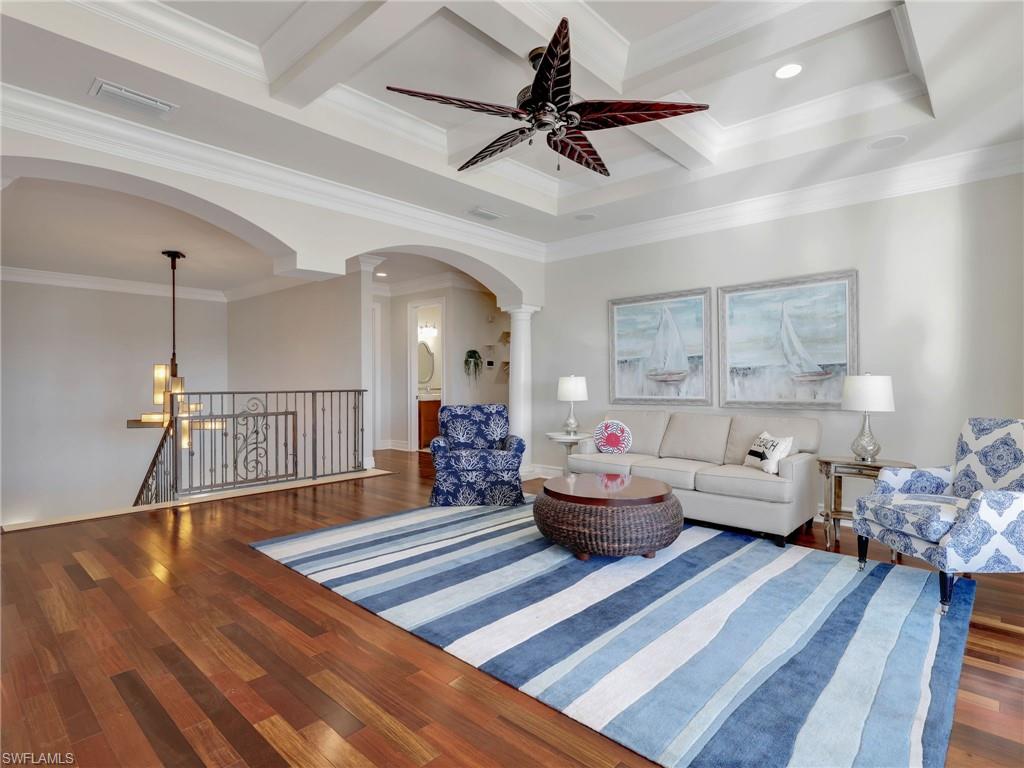 264 Bayview Avenue Naples, FL 34108 - Photo 34 of 50 a living room with furniture and a wooden floor