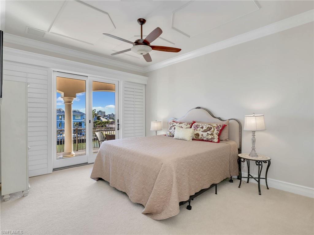 264 Bayview Avenue Naples, FL 34108 - Photo 37 of 50 a bedroom with a bed and a large window