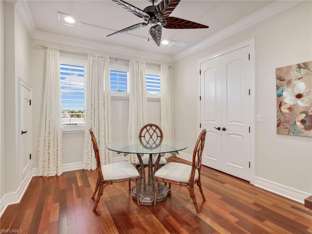 264 Bayview Avenue Naples, FL 34108 - Photo 42 of 50 a view of a dining room with furniture window and wooden floor