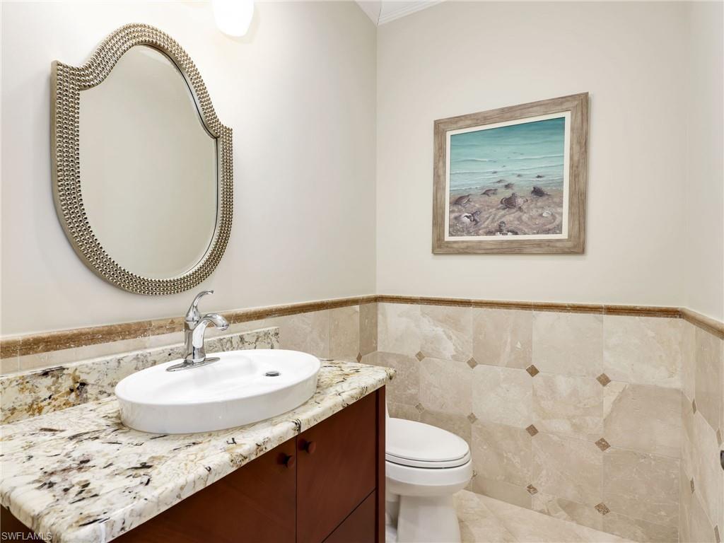 264 Bayview Avenue Naples, FL 34108 - Photo 43 of 50 a bathroom with a sink and a mirror