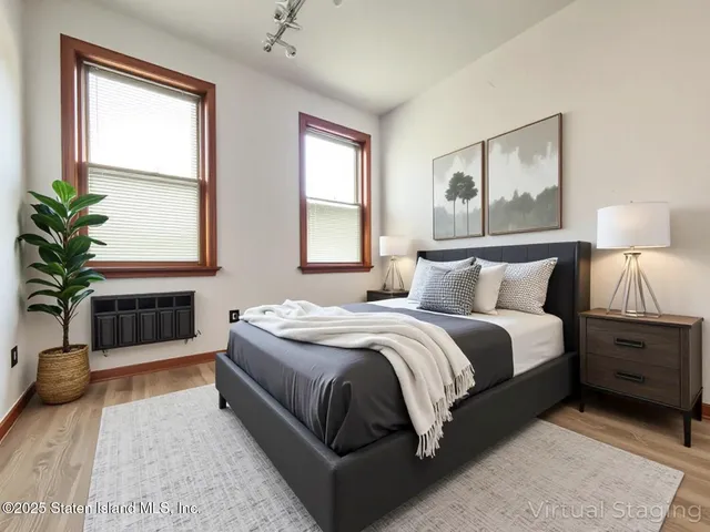 a spacious bedroom with a large bed and a couch