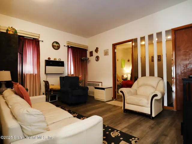a living room with furniture fireplace and flat screen tv