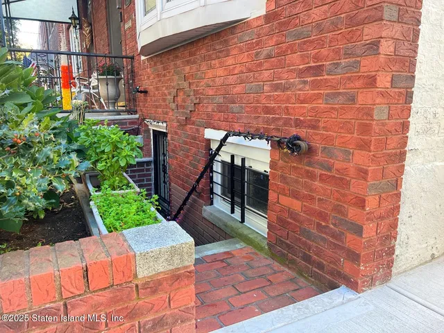 a brick building with a yard