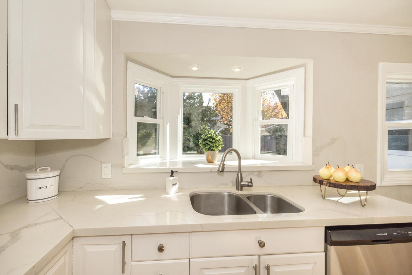182 Rutherford Avenue Redwood City, CA 94061 - Photo 13 of 34 a kitchen with a sink and a window