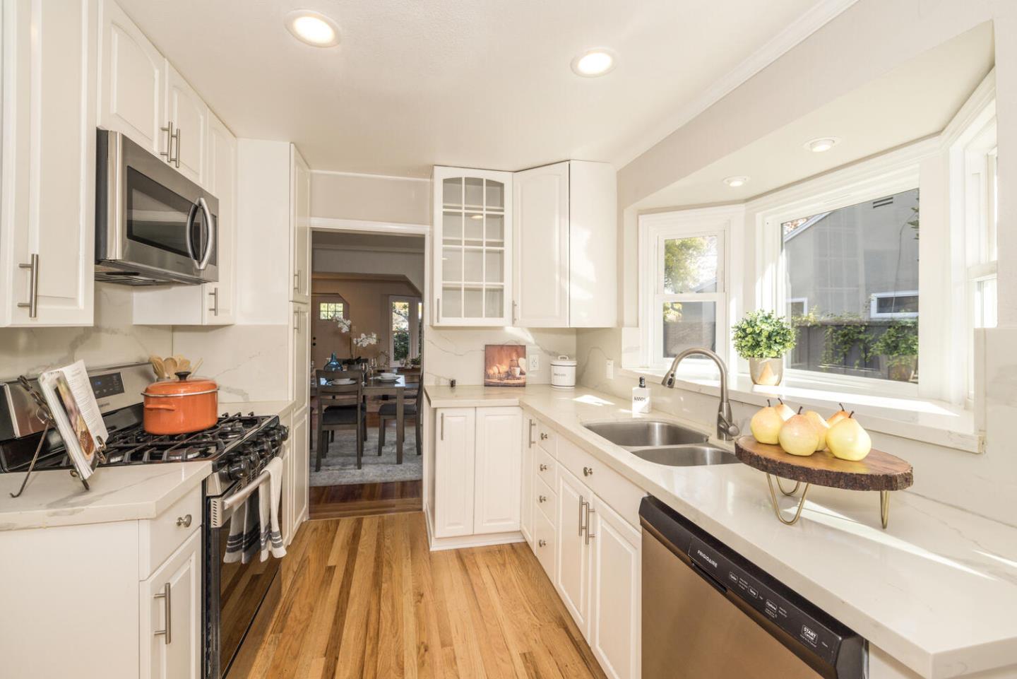 182 Rutherford Avenue Redwood City, CA 94061 - Photo 14 of 34 a kitchen with a sink stove and microwave