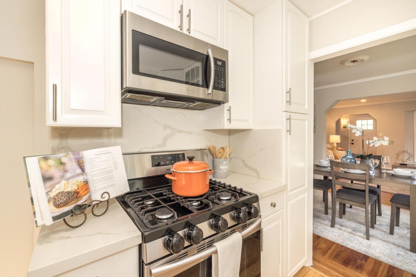 182 Rutherford Avenue Redwood City, CA 94061 - Photo 15 of 34 a kitchen with a stove and a microwave
