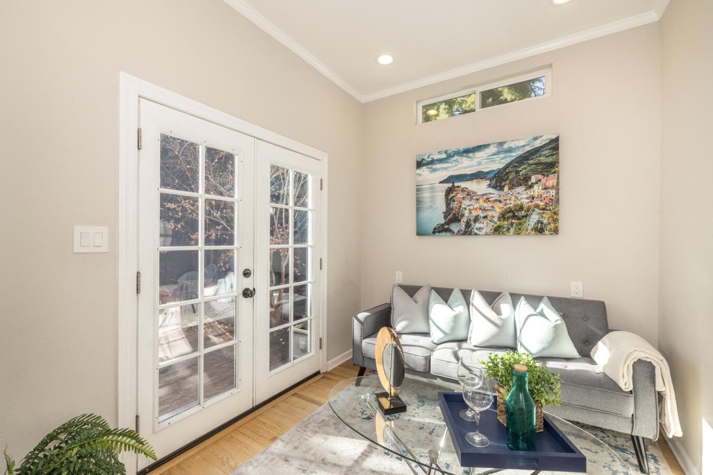 182 Rutherford Avenue Redwood City, CA 94061 - Photo 17 of 34 a living room with furniture and a painting on the wall