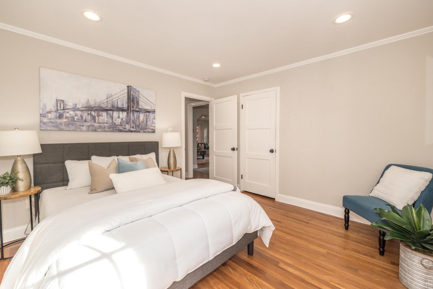 182 Rutherford Avenue Redwood City, CA 94061 - Photo 21 of 34 a bedroom with a bed and wooden floor
