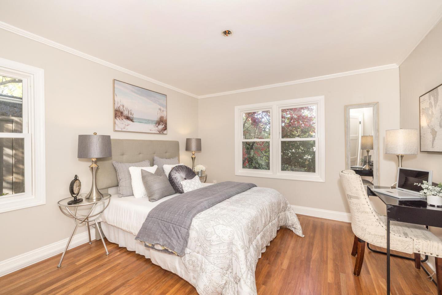 182 Rutherford Avenue Redwood City, CA 94061 - Photo 22 of 34 a bedroom with a bed and wooden floor