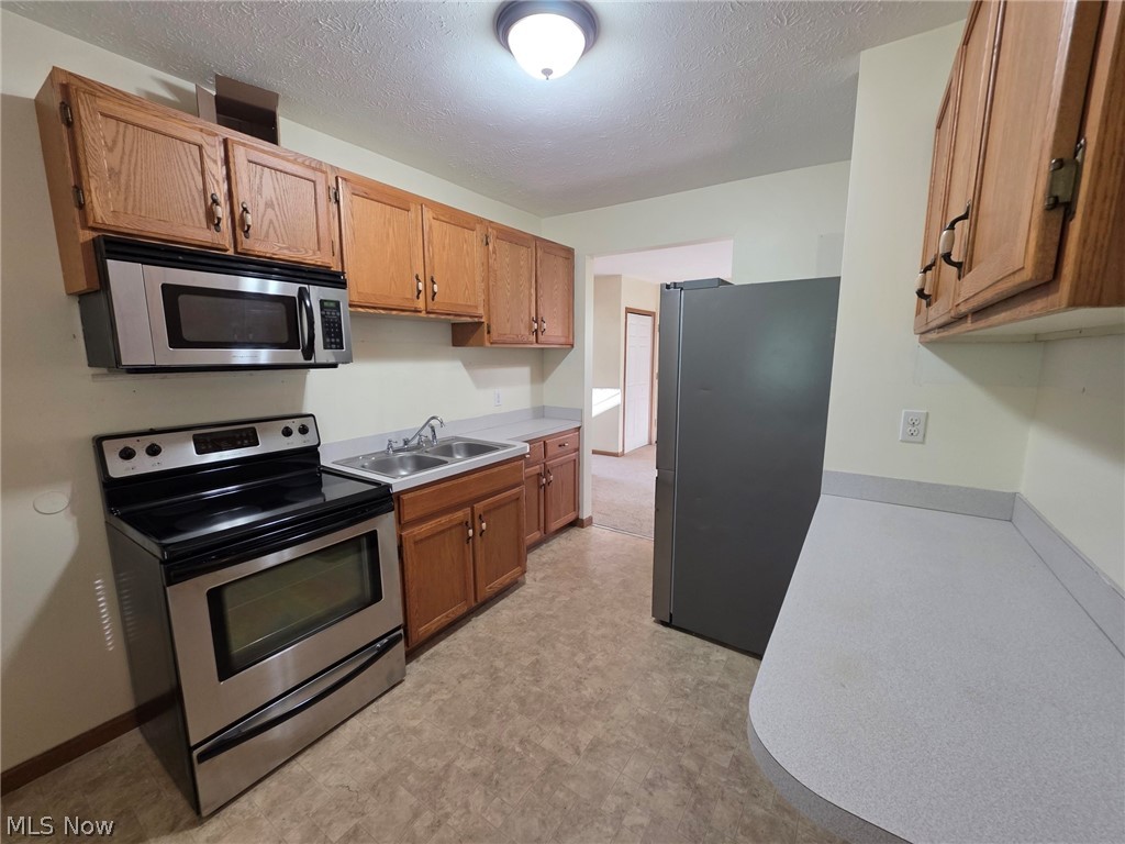 95 Erie Street Rittman, OH 44270 - Photo 4 of 25 Kitchen with stainless steel appliances