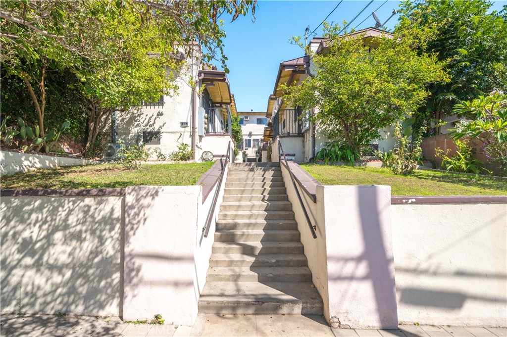 1727 Bellevue Avenue Los Angeles, CA 90026 - Photo 1 of 40 a view of swimming pool with lawn chairs and plants
