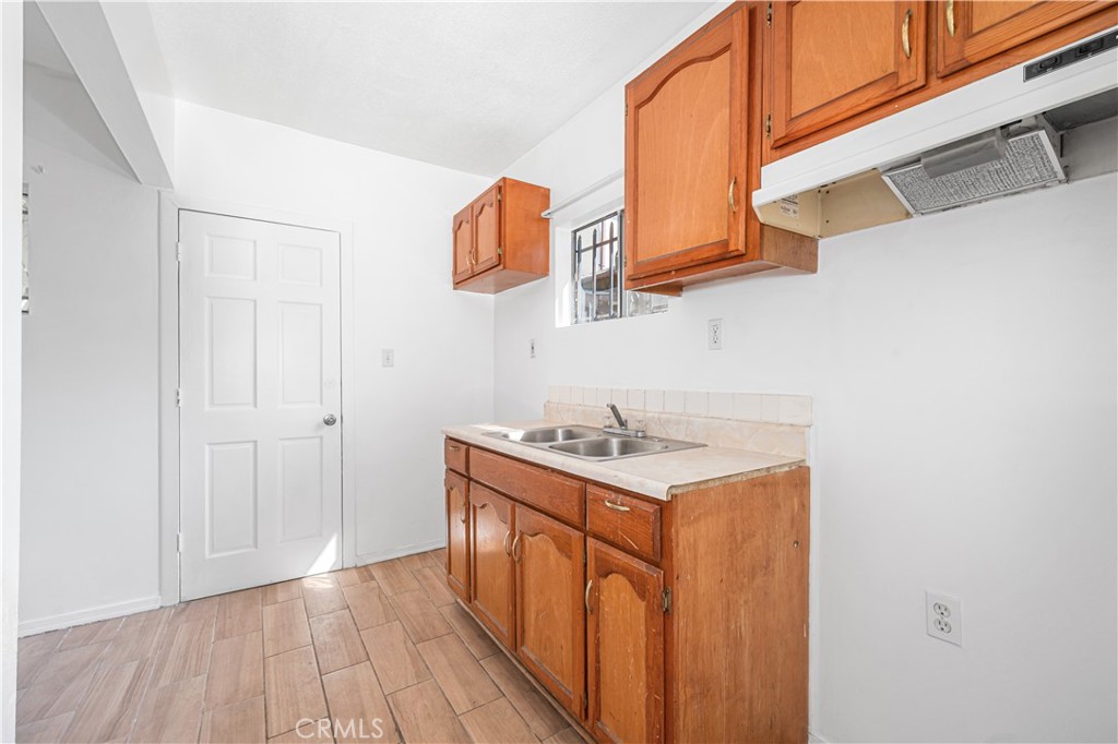 1727 Bellevue Avenue Los Angeles, CA 90026 - Photo 14 of 40 a utility room with a sink a mirror and vanity