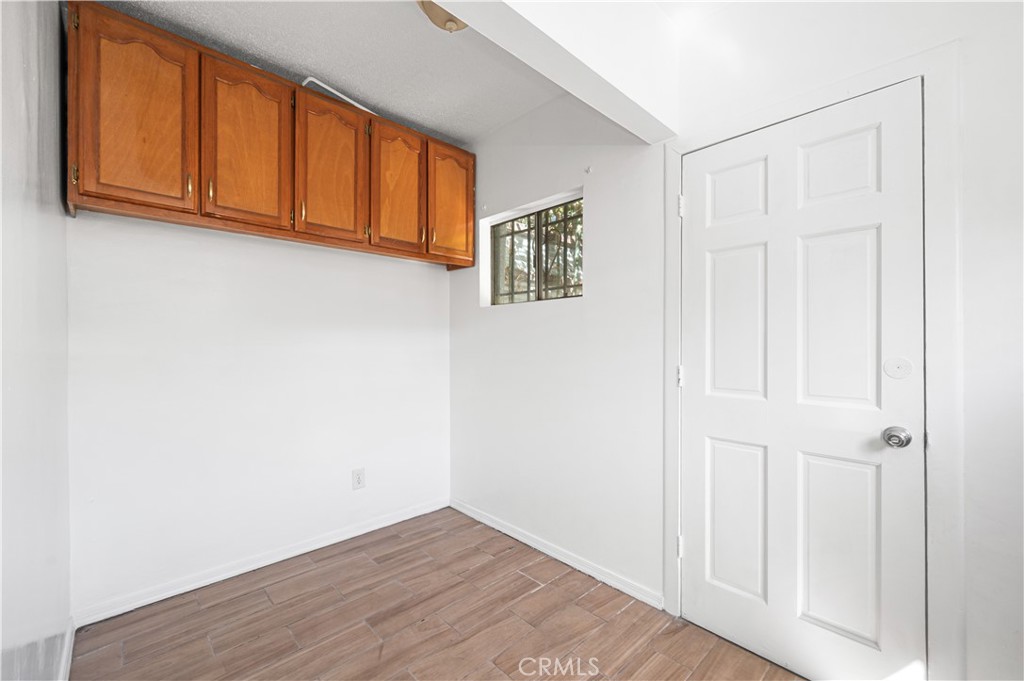 1727 Bellevue Avenue Los Angeles, CA 90026 - Photo 16 of 40 a view of an empty room with wooden floor
