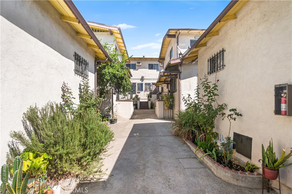 1727 Bellevue Avenue Los Angeles, CA 90026 - Photo 2 of 40 a view of a pathway along with potted plants