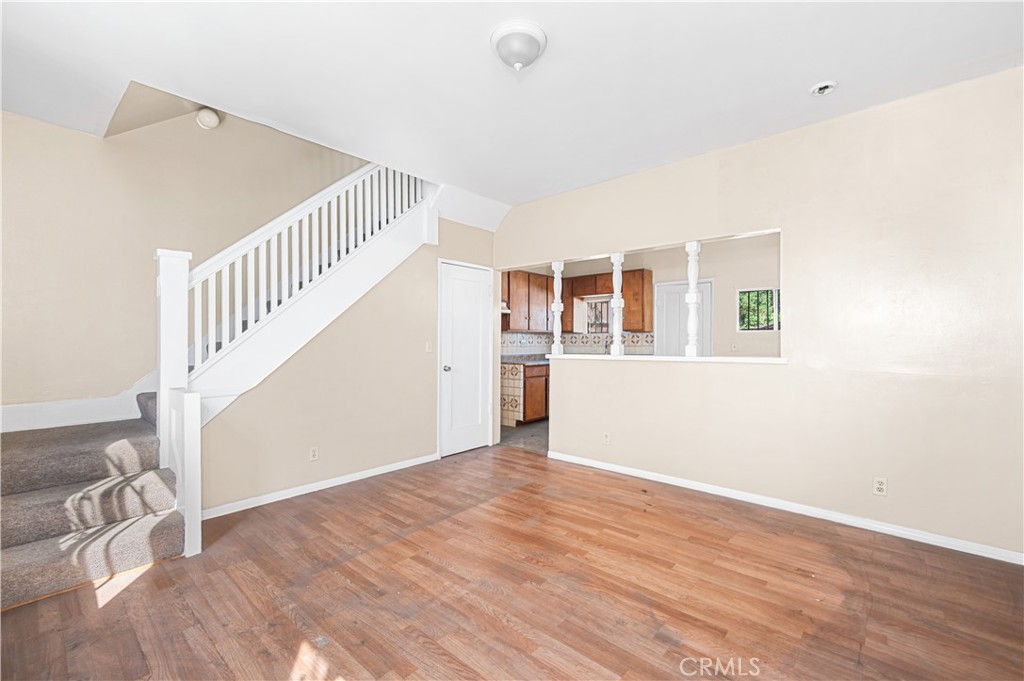 1727 Bellevue Avenue Los Angeles, CA 90026 - Photo 29 of 40 a view of an empty room with stairs and a window