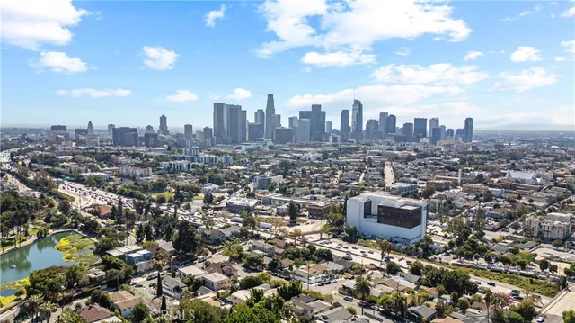 a view of swimming pool with outdoor seating and plants