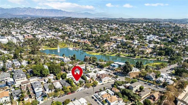 an aerial view of residential houses with outdoor space