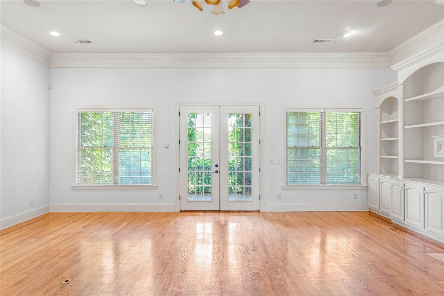1400 Franklin Road Brentwood, TN 37027 - Photo 17 of 67 a view of an empty room with a window and wooden floor