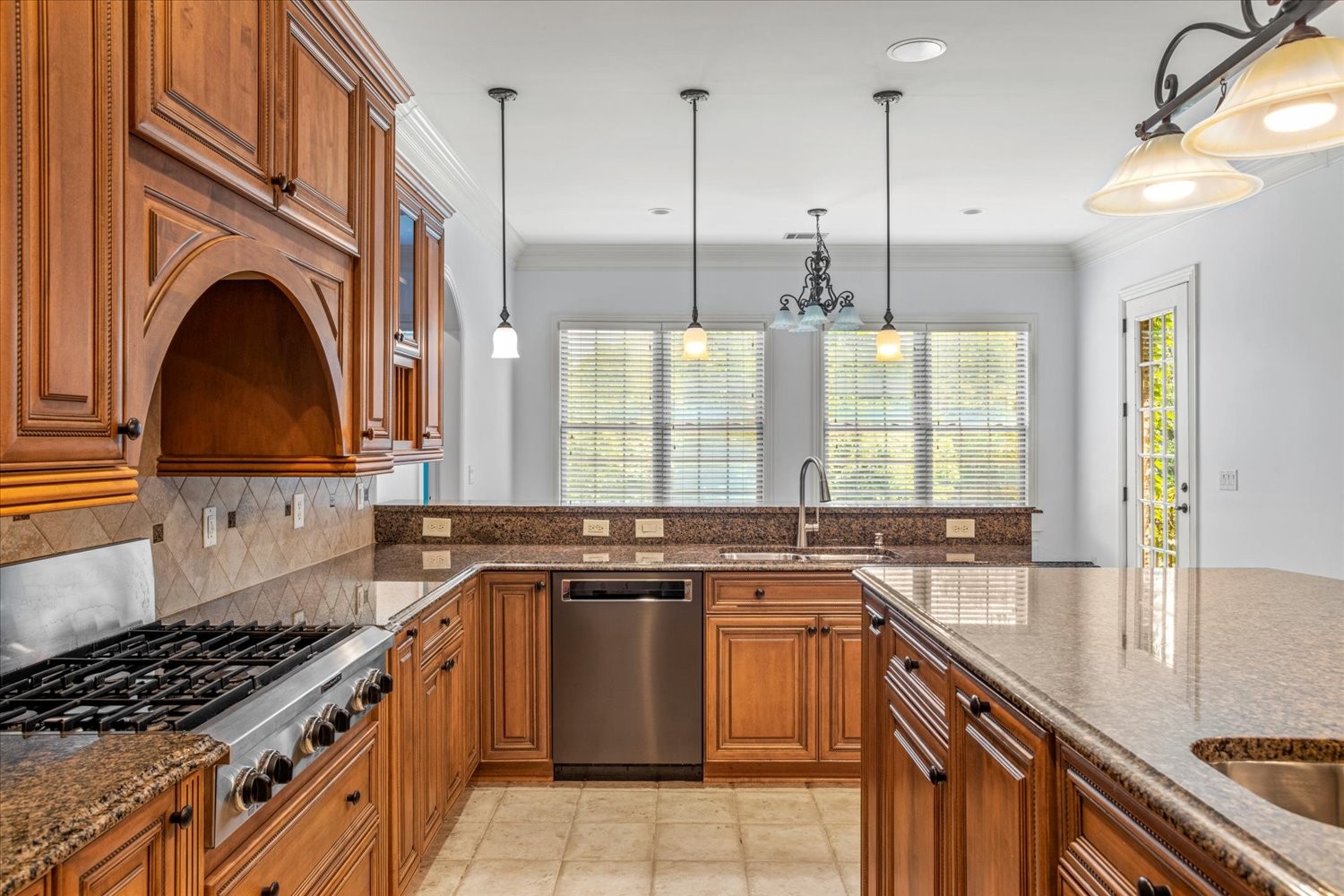 1400 Franklin Road Brentwood, TN 37027 - Photo 24 of 67 a kitchen with stainless steel appliances granite countertop a stove a sink and a granite counter tops