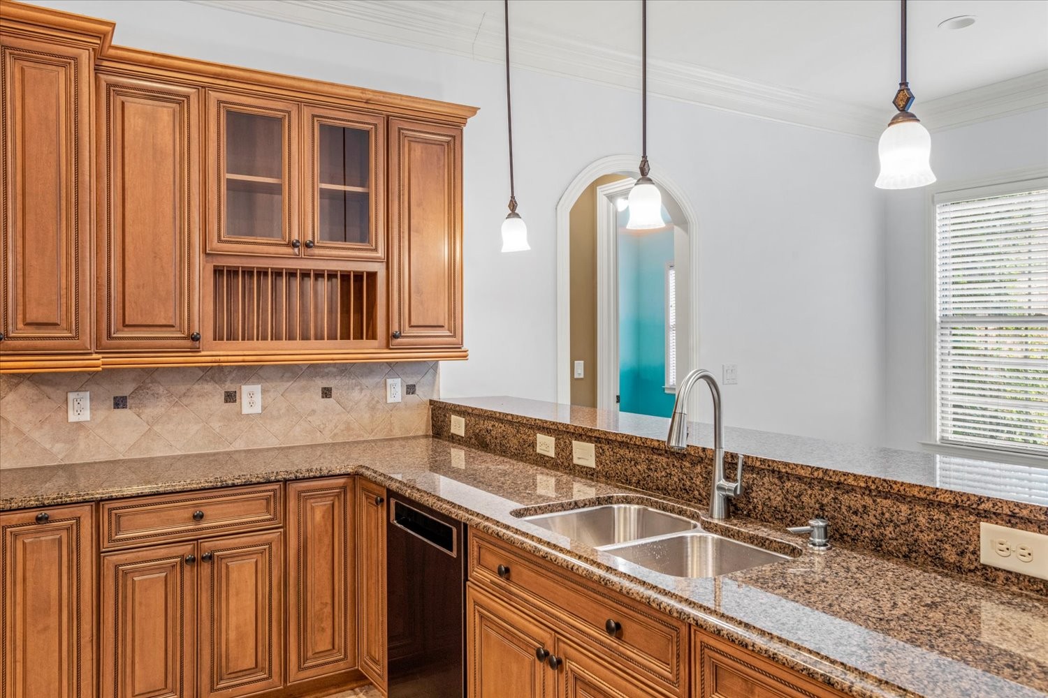1400 Franklin Road Brentwood, TN 37027 - Photo 25 of 67 a kitchen with granite countertop a sink and dishwasher with wooden floor