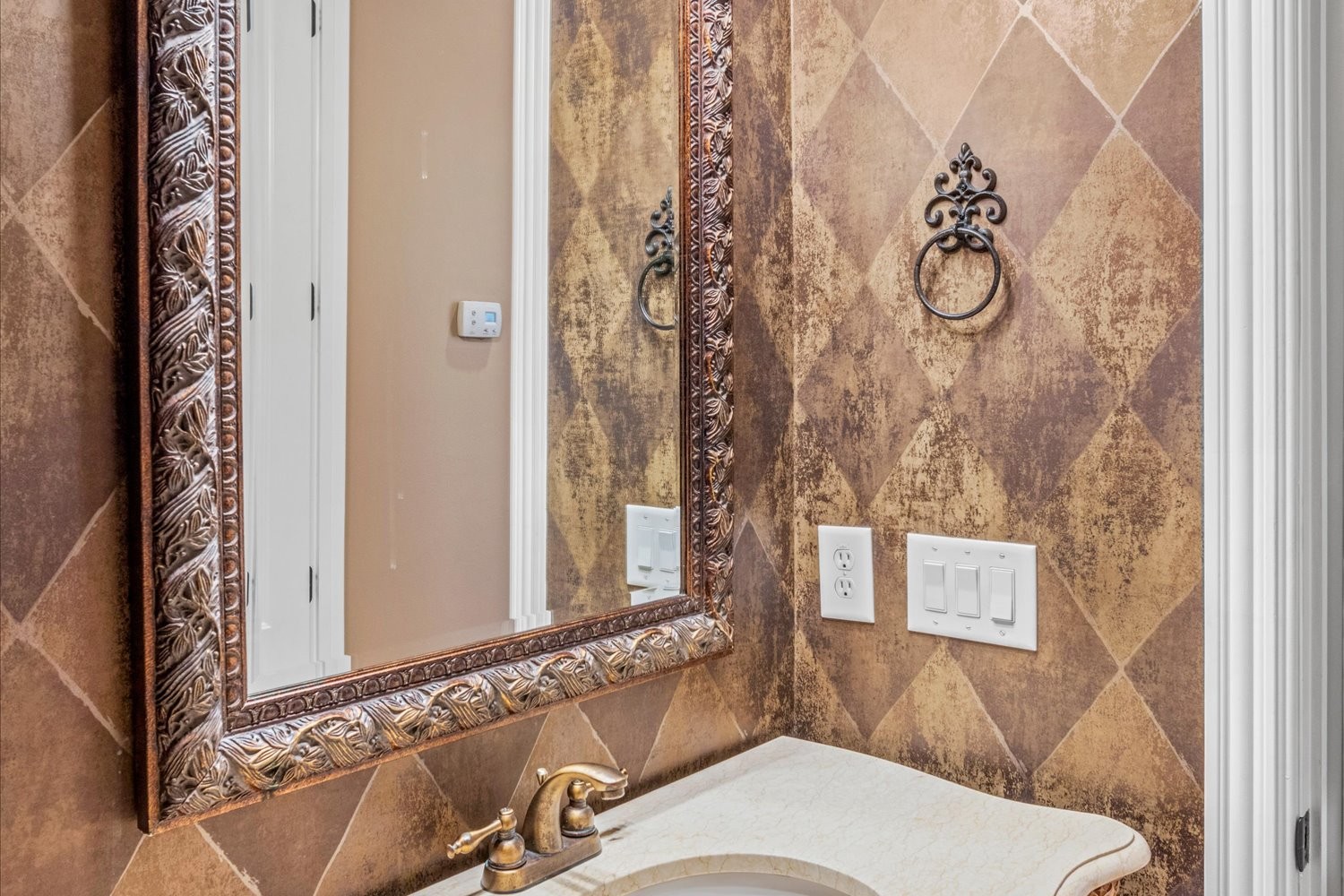 1400 Franklin Road Brentwood, TN 37027 - Photo 37 of 67 a bathroom with a sink and mirror with bathtub